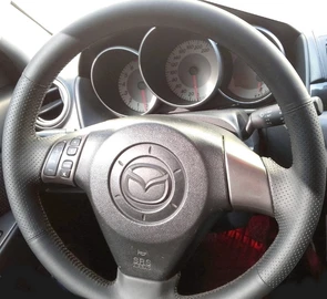 {{photo.Alt || photo.Description || 'Оплетка на руль из натуральной кожи Mazda 2-I (DY) 2003-2007'}}