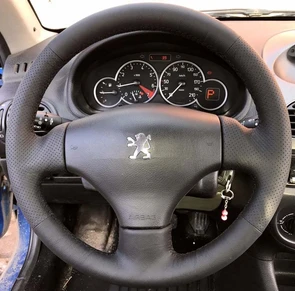 {{photo.Alt || photo.Description || 'Оплетка на руль из натуральной кожи Peugeot 206 (1998-2012)'}}
