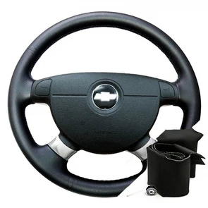 {{photo.Alt || photo.Description || 'Оплетка на резиновый руль Chevrolet Aveo I (2003-2011)'}}